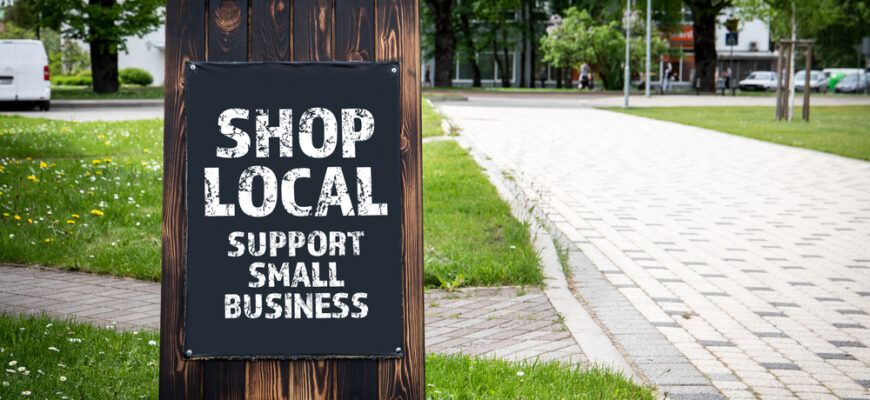 Shop,Local.,Support,Small,Business.,Wooden,Billboard,On,The,Street,